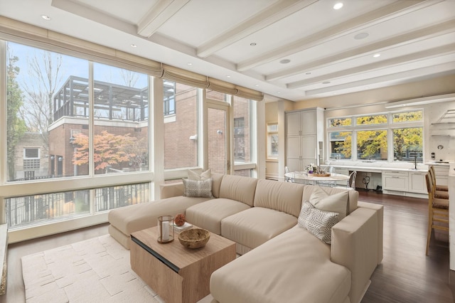 sunroom with built in study area and beamed ceiling