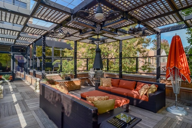 wooden deck with outdoor lounge area and a pergola