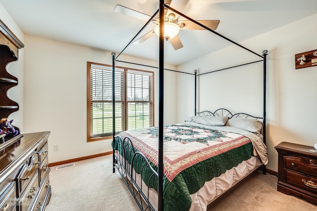 bedroom with light carpet, baseboards, visible vents, and ceiling fan