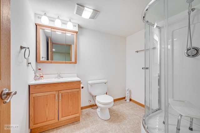 bathroom with toilet, vanity, visible vents, baseboards, and a shower stall