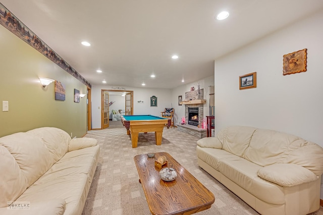 recreation room featuring a stone fireplace, billiards, light colored carpet, and recessed lighting