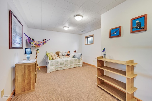 carpeted bedroom with baseboards