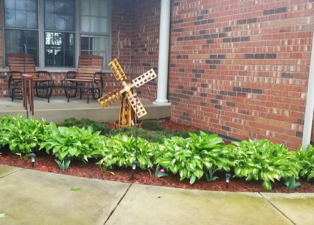 exterior space featuring brick siding