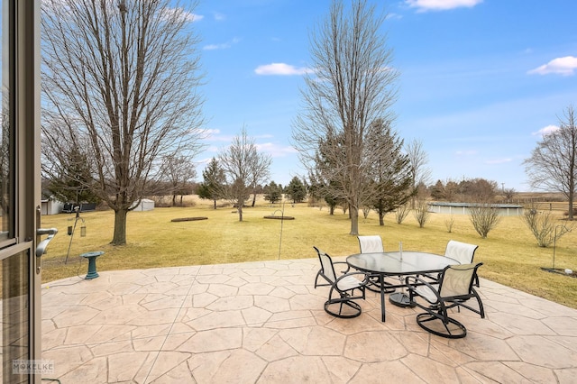 view of patio featuring outdoor dining area