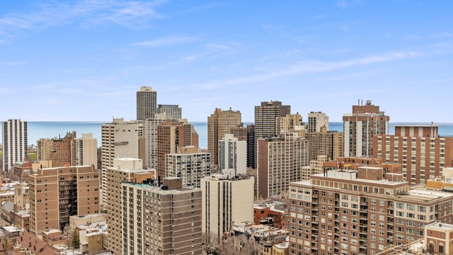 property's view of city featuring a water view