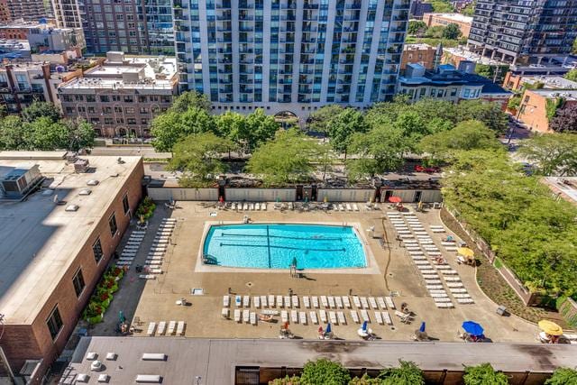 view of swimming pool featuring a view of city