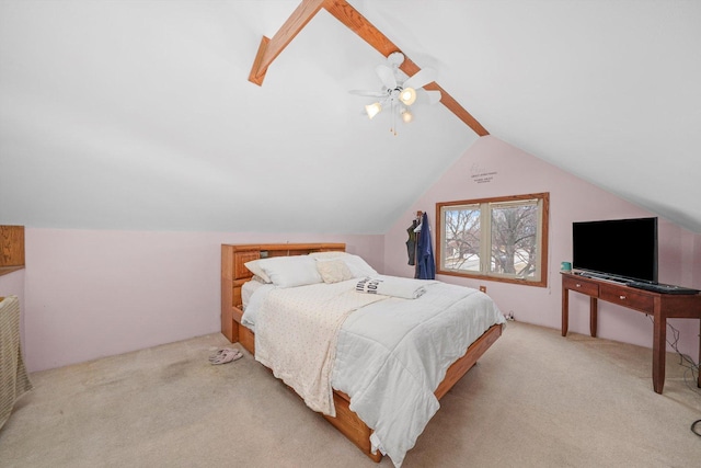 bedroom with vaulted ceiling, a ceiling fan, and light colored carpet