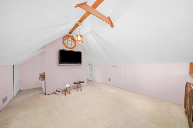 additional living space featuring lofted ceiling with beams, carpet floors, and visible vents