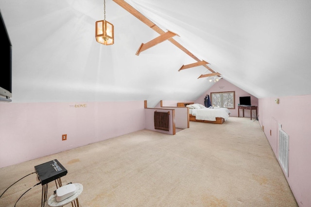 unfurnished bedroom featuring carpet floors, visible vents, and vaulted ceiling