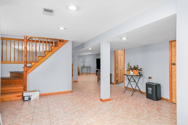 interior space featuring baseboards, stairs, visible vents, and recessed lighting