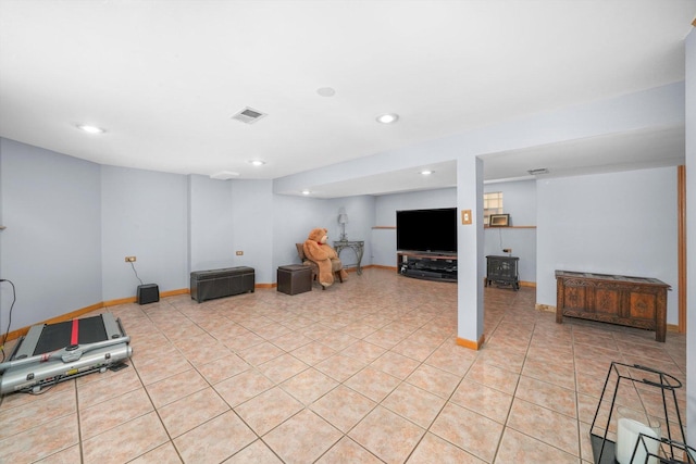 exercise room featuring light tile patterned floors, baseboards, visible vents, and recessed lighting