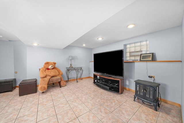 living area with light tile patterned floors, baseboards, and recessed lighting