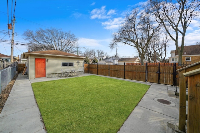 view of yard featuring a patio area, a fenced backyard, and a gate