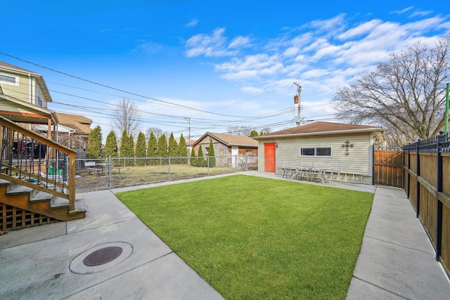 view of yard with a patio area and a fenced backyard