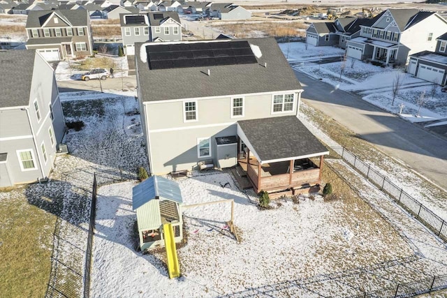 birds eye view of property with a residential view