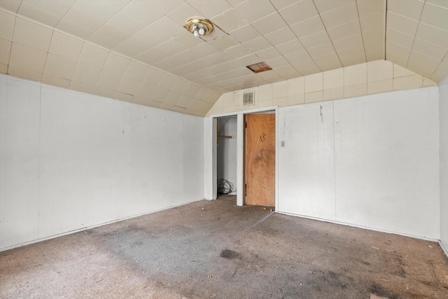 interior space with lofted ceiling and visible vents