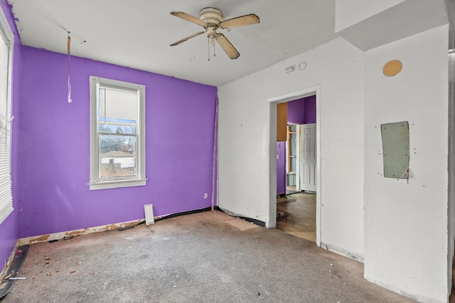 unfurnished room with ceiling fan