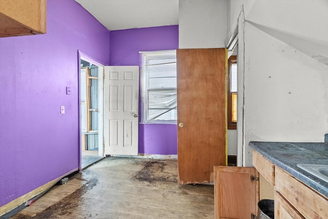 interior space featuring baseboards