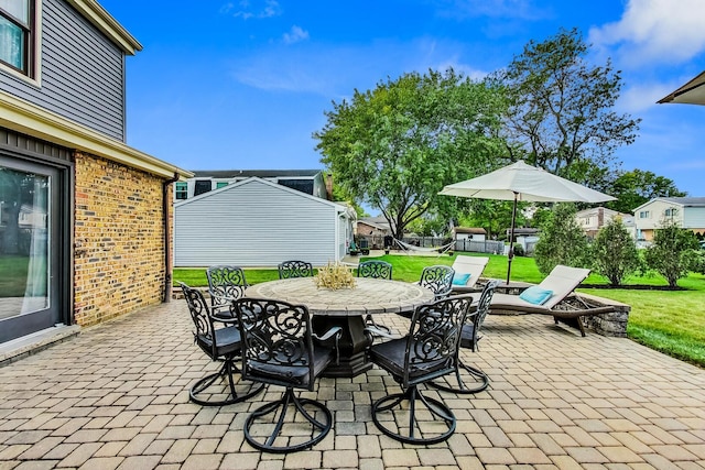 view of patio / terrace with an outdoor structure and outdoor dining space