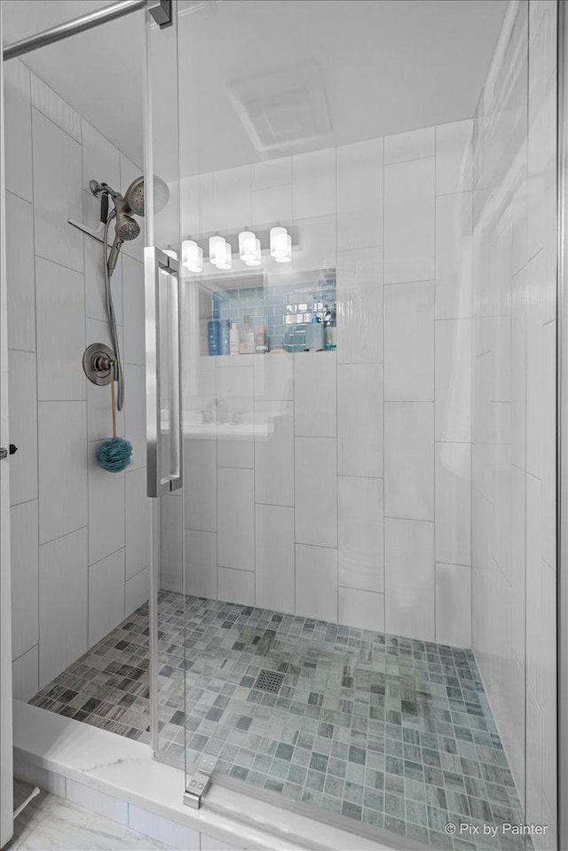 full bath featuring a shower stall