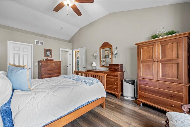 bedroom with lofted ceiling, dark wood-type flooring, visible vents, and a ceiling fan