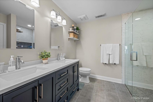 bathroom with double vanity, a stall shower, a sink, and visible vents