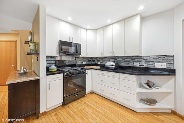 kitchen featuring light wood-style flooring, black appliances, white cabinetry, open shelves, and backsplash