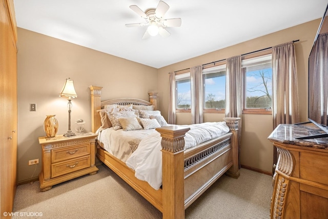 bedroom with baseboards, a ceiling fan, and light colored carpet