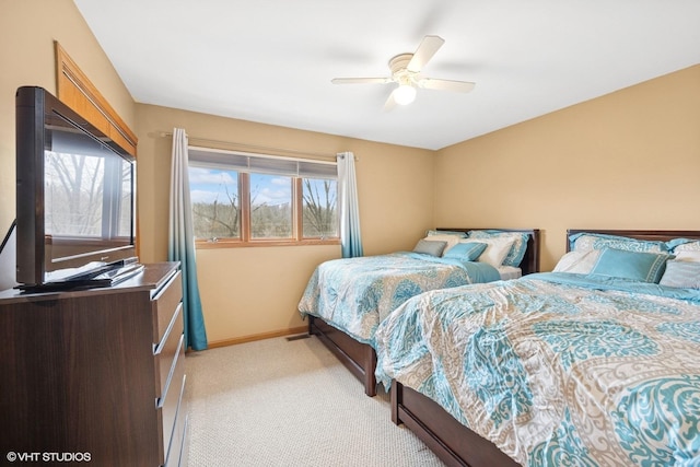 bedroom with baseboards, a ceiling fan, and light colored carpet