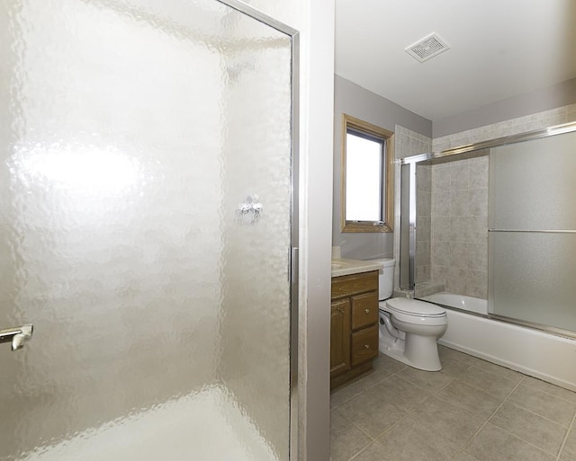 full bath with visible vents, toilet, enclosed tub / shower combo, tile patterned flooring, and vanity