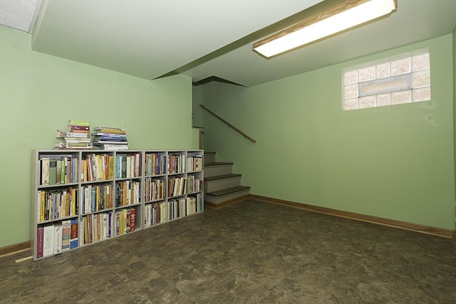 interior space with stairway and baseboards