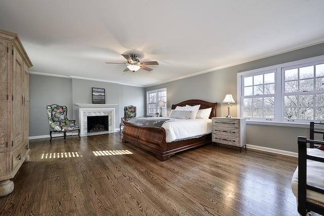 bedroom featuring ornamental molding, dark wood-type flooring, and a fireplace