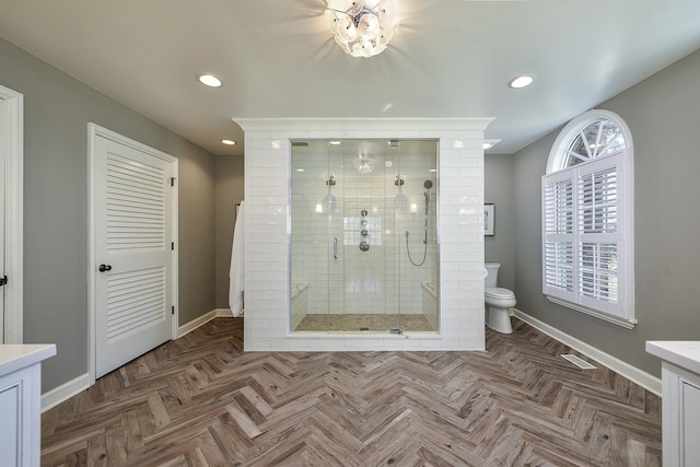 full bath with recessed lighting, toilet, a stall shower, vanity, and baseboards