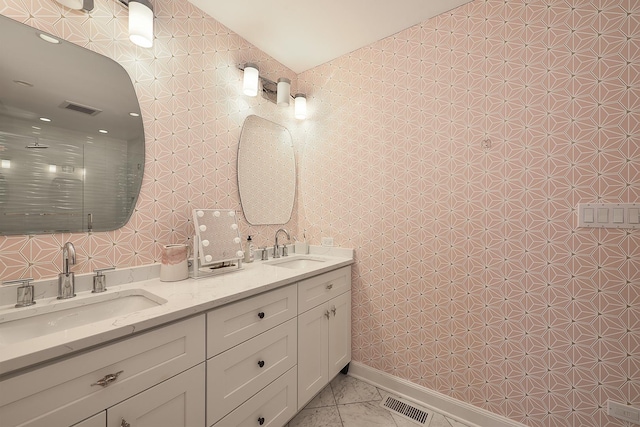 full bath featuring tile patterned flooring, a sink, and visible vents