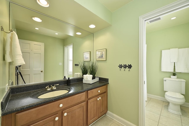 bathroom with tile patterned flooring, vanity, toilet, and recessed lighting