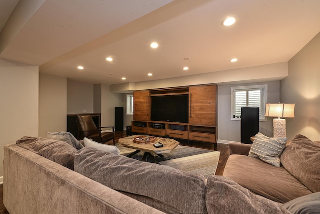 living area with dark wood-style floors, recessed lighting, and baseboards