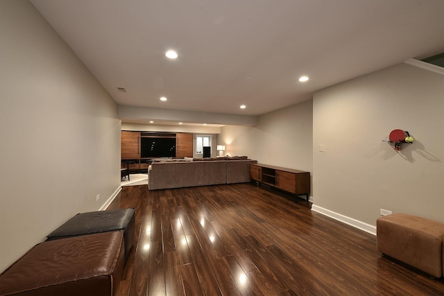 unfurnished living room with dark wood-style floors, recessed lighting, visible vents, and baseboards