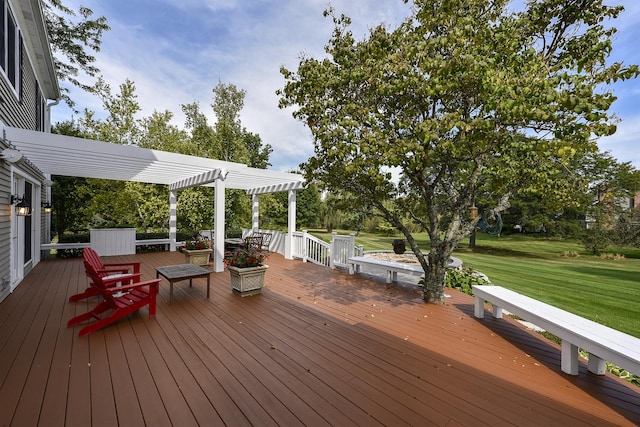 wooden terrace featuring a lawn and a pergola