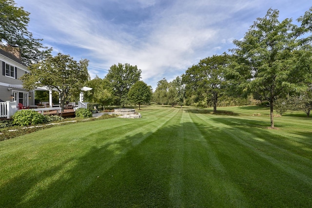 view of yard with a wooden deck