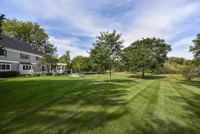 view of yard featuring a wooden deck