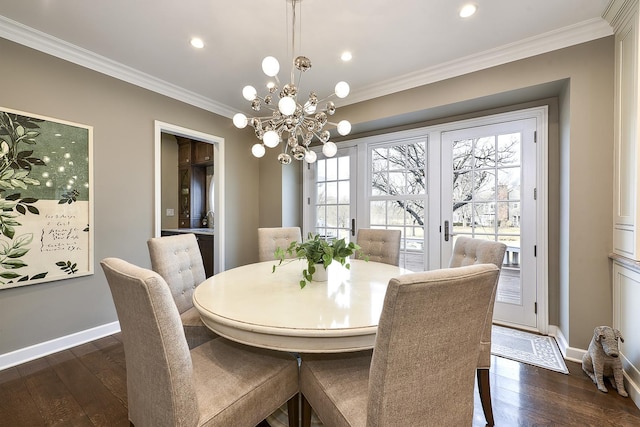 dining area with baseboards, dark wood finished floors, and crown molding