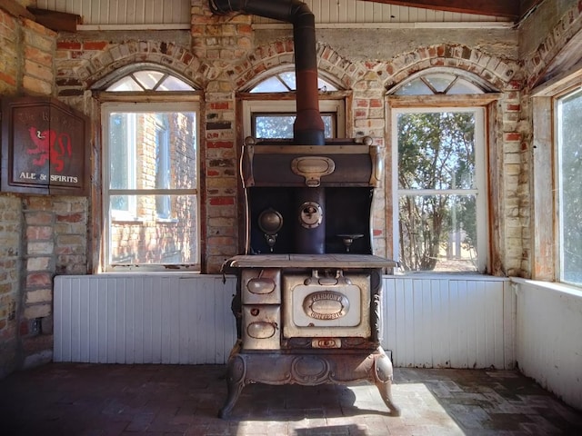 interior details with radiator heating unit and a wood stove