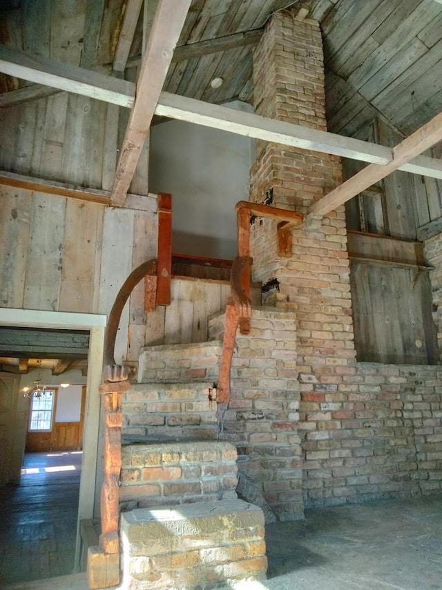 staircase with high vaulted ceiling