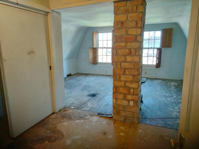 bonus room featuring visible vents and vaulted ceiling