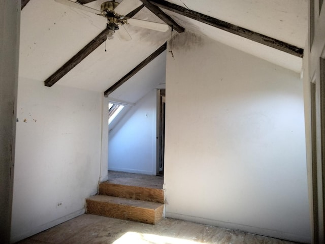 staircase featuring lofted ceiling with beams and ceiling fan