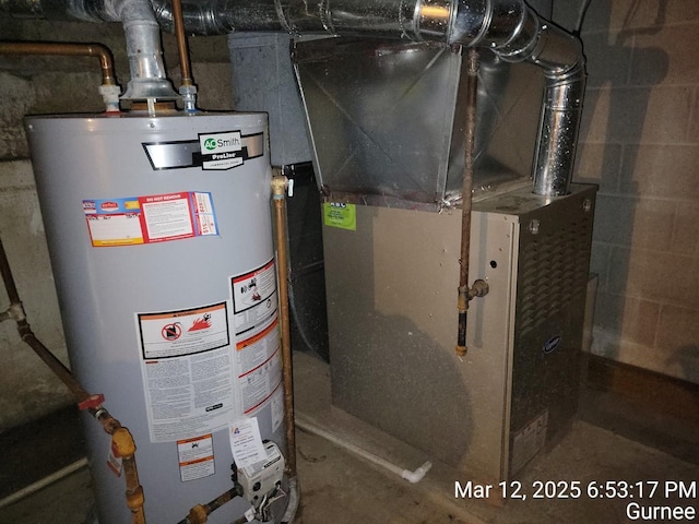 utility room with heating unit and gas water heater