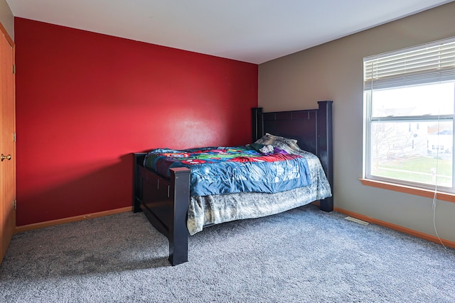 704 Doral Dr, Marengo, IL 60152 - bedroom with visible vents, baseboards, and carpet flooring