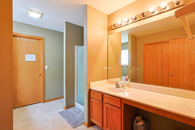 704 Doral Dr, Marengo, IL 60152 - full bathroom with tile patterned floors, vanity, baseboards, and a stall shower