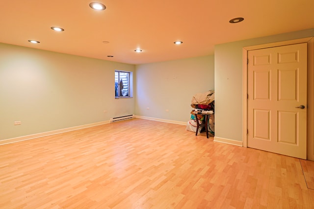 704 Doral Dr, Marengo, IL 60152 - unfurnished room featuring light wood-type flooring, a baseboard heating unit, baseboards, and recessed lighting
