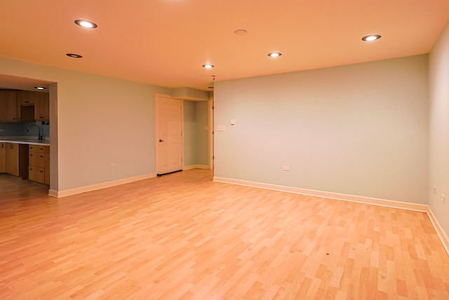 704 Doral Dr, Marengo, IL 60152 - spare room featuring recessed lighting, light wood-style flooring, baseboards, and a sink